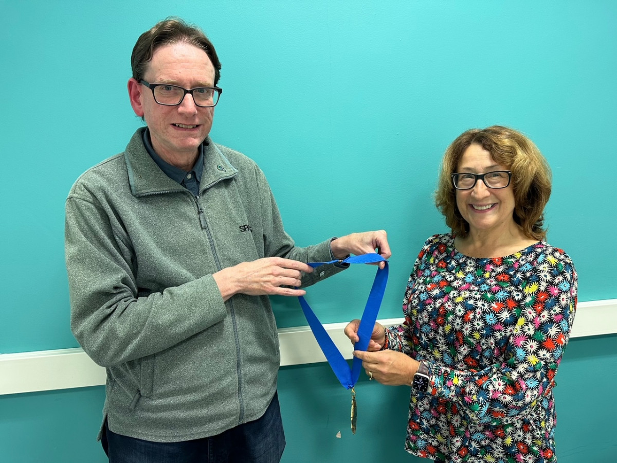 Joanne Rout CSI President 2023-2025 and Dr Joe McGinnis Senior Vice President 2023-2025.  Joe was President 2021-2023, and the image shows him handing the Presidential Medal to Joanne